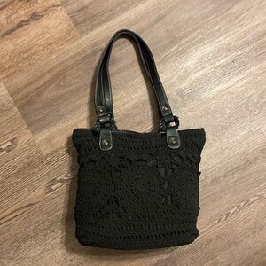 Black purse with crocheted design